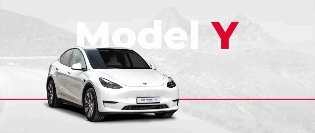 Biała Tesla Model Y, kompaktowy elektryczny SUV o minimalistycznym wyglądzie